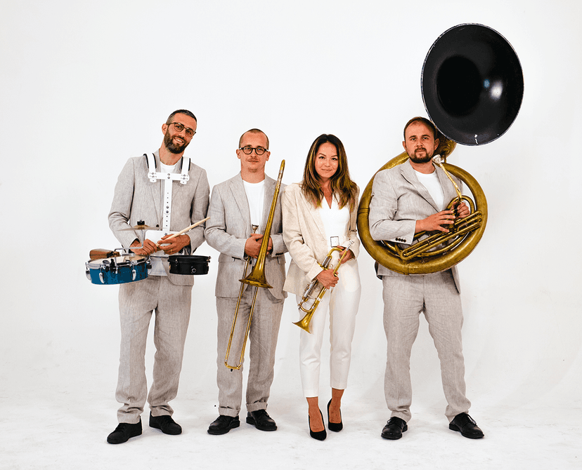 The band dressed smartly on a plain white background